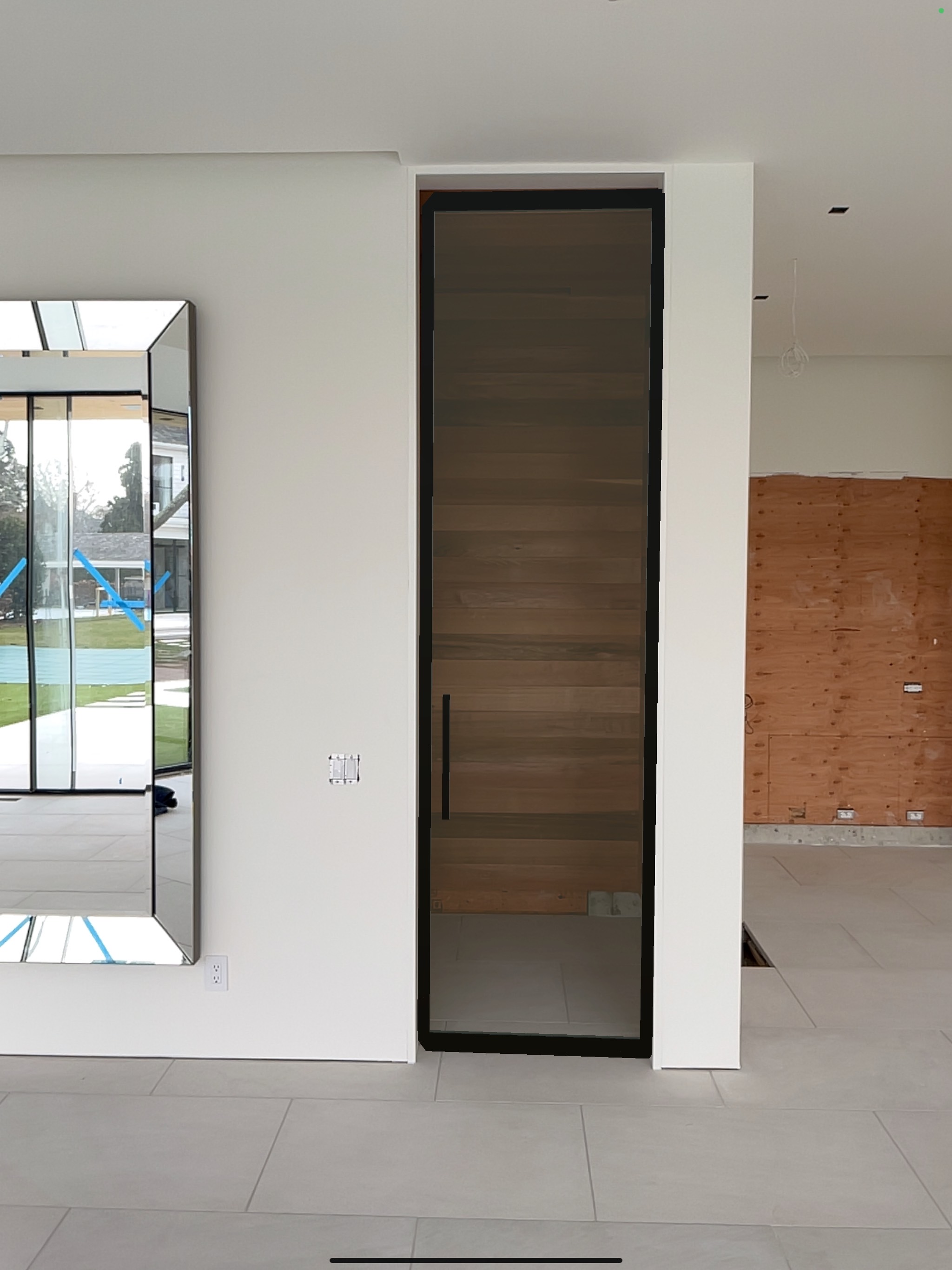 Installed — custom low iron glass privacy door with anodized aluminum frame by WiseGlass NY, Water Mill estate